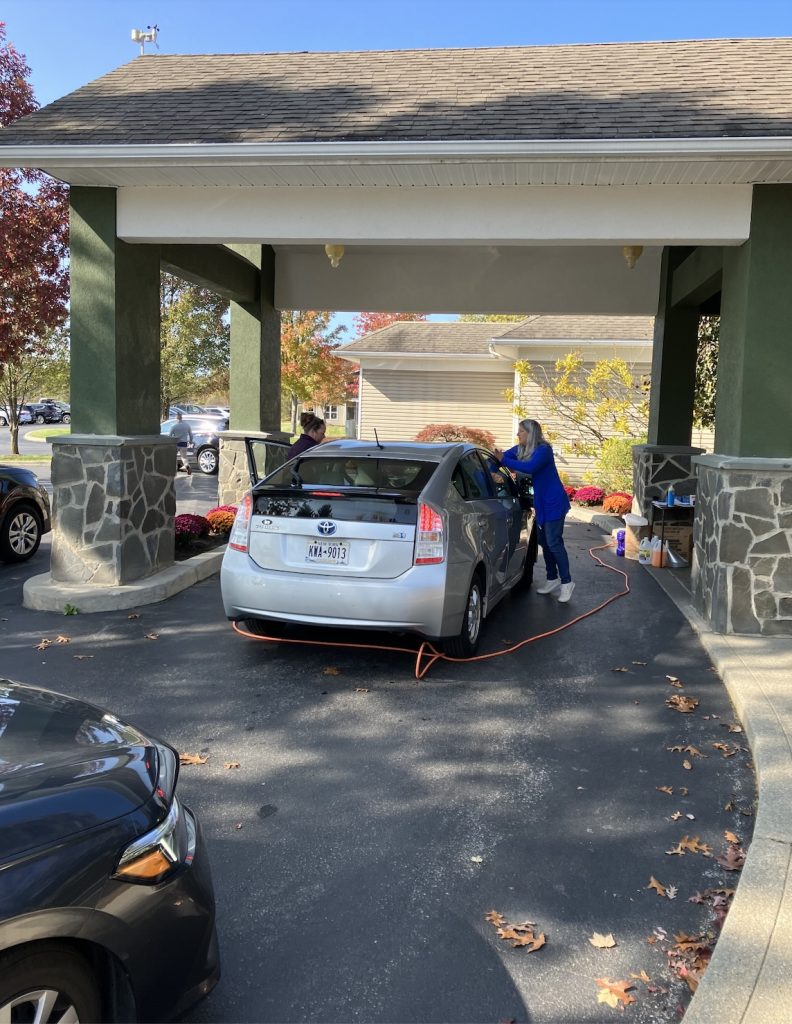 staff checking vehicles